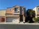 Charming two-story home featuring a two-car garage and appealing facade at 6546 Churnet Valley Ave, Las Vegas, NV 89139