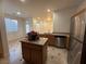 Modern kitchen island with granite countertop and stainless-steel appliances at 6546 Churnet Valley Ave, Las Vegas, NV 89139