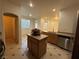 Kitchen island with granite countertop and stainless-steel dishwasher at 6546 Churnet Valley Ave, Las Vegas, NV 89139