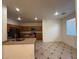 Open kitchen featuring wood cabinets, granite counters, stainless appliances, and tiled floors at 6546 Churnet Valley Ave, Las Vegas, NV 89139