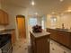 Kitchen featuring an island with granite countertop, stainless-steel appliances, and pantry at 6546 Churnet Valley Ave, Las Vegas, NV 89139