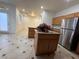 Modern kitchen island with granite countertop and stainless-steel refrigerator at 6546 Churnet Valley Ave, Las Vegas, NV 89139