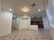 Inviting living space with tiled floors leading to a view of the kitchen area at 6546 Churnet Valley Ave, Las Vegas, NV 89139