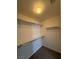 Neutral walk-in closet with shelving installed for organized storage at 6546 Churnet Valley Ave, Las Vegas, NV 89139