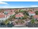 Aerial view of community with manicured landscaping, swimming pool and common areas at 725 Wheat Ridge Ln # 201, Las Vegas, NV 89145
