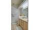 Bright bathroom featuring double sinks, neutral countertops and tile flooring and modern finishes at 725 Wheat Ridge Ln # 201, Las Vegas, NV 89145