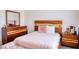 Bedroom features a large bed with matching dresser, nightstand and a tufted bench at 725 Wheat Ridge Ln # 201, Las Vegas, NV 89145