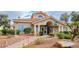 Exterior of the community clubhouse with lush landscaping and ample parking at 725 Wheat Ridge Ln # 201, Las Vegas, NV 89145