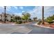 Community entrance showcases well-maintained landscaping and multiple residential buildings at 725 Wheat Ridge Ln # 201, Las Vegas, NV 89145