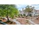Inviting townhouse complex with beautifully maintained landscaping and walking paths at 725 Wheat Ridge Ln # 201, Las Vegas, NV 89145