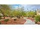 Lushly landscaped grounds with walking paths and mature trees for a peaceful setting at 725 Wheat Ridge Ln # 201, Las Vegas, NV 89145