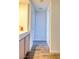 Bright hallway features wood flooring, built-in storage, and neutral paint at 725 Wheat Ridge Ln # 201, Las Vegas, NV 89145