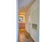 Hallway leading to a bathroom vanity with wood-style flooring, neutral walls and recessed lighting at 725 Wheat Ridge Ln # 201, Las Vegas, NV 89145