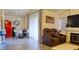 Spacious living room area with a dining space featuring a red refrigerator appliance at 725 Wheat Ridge Ln # 201, Las Vegas, NV 89145