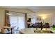 Open-concept living room with large windows, a fireplace, and modern furnishings at 725 Wheat Ridge Ln # 201, Las Vegas, NV 89145