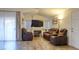 Inviting living room with plush seating, a modern fireplace, and a sliding glass door to the backyard at 725 Wheat Ridge Ln # 201, Las Vegas, NV 89145
