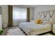 Elegant bedroom with large bed, soft lighting, and neutral tones at 725 Wheat Ridge Ln # 201, Las Vegas, NV 89145