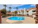 Resort-style pool area with lounge chairs and covered seating for relaxation at 725 Wheat Ridge Ln # 201, Las Vegas, NV 89145