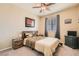Inviting bedroom with soft carpet, ceiling fan, and tasteful decor at 7349 Merimack Oaks St, Las Vegas, NV 89166