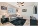 Cozy den with tile flooring, ample natural light, and neutral paint, perfect for relaxation at 7349 Merimack Oaks St, Las Vegas, NV 89166