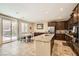 Well-appointed kitchen with granite counters, stainless steel appliances, and direct access to the pool at 7349 Merimack Oaks St, Las Vegas, NV 89166