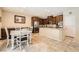 Spacious kitchen featuring stainless steel appliances, granite countertops, and a stylish dining area at 7349 Merimack Oaks St, Las Vegas, NV 89166
