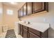 Practical laundry room with overhead cabinets, a sink, a washing machine, and a dryer at 7349 Merimack Oaks St, Las Vegas, NV 89166