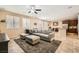 Open-concept living area with tile flooring, recessed lighting, and direct access to the kitchen at 7349 Merimack Oaks St, Las Vegas, NV 89166