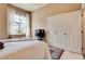 Comfortable bedroom with a full-sized bed, large closet, and a window with sheer curtains at 7432 Tahoe Basin Dr, Las Vegas, NV 89129