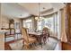 Formal dining room with a chandelier, a view of the backyard, and a table set for six at 7432 Tahoe Basin Dr, Las Vegas, NV 89129