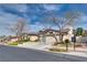 Attractive single-story home featuring a large driveway, a three-car garage, and mature trees at 7432 Tahoe Basin Dr, Las Vegas, NV 89129