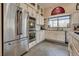 Updated kitchen featuring stainless steel appliances, light-colored cabinets, and tile backsplash at 7432 Tahoe Basin Dr, Las Vegas, NV 89129