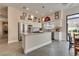 Spacious kitchen features stainless steel appliances, an island, and a view to the backyard at 7432 Tahoe Basin Dr, Las Vegas, NV 89129