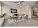 Comfortable living room with neutral color palette, stylish furniture, and large area rug at 7432 Tahoe Basin Dr, Las Vegas, NV 89129