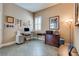 Home office with functional workspace, plantation shutters, and decorative artwork on the walls at 7432 Tahoe Basin Dr, Las Vegas, NV 89129