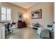 Bright office space with plantation shutters, neutral walls, tile floors, and functional workspace at 7432 Tahoe Basin Dr, Las Vegas, NV 89129