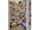 Walk-in pantry with abundant white shelving providing ample storage space for food and kitchen appliances at 7432 Tahoe Basin Dr, Las Vegas, NV 89129