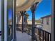 Private balcony with sleek railings and decorative pillars showcasing the architecture of the neighborhood at 7695 Windy Meadow Ave, Las Vegas, NV 89178