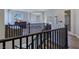 Open hallway with dark wood trim and a view of the landscape, blending style and sophistication at 7695 Windy Meadow Ave, Las Vegas, NV 89178