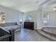 Loft area featuring a tufted daybed, and large windows, creating a cozy and inviting space at 7695 Windy Meadow Ave, Las Vegas, NV 89178