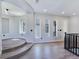 Expansive loft with stepped flooring and large windows, showcasing a blend of modern design and comfort at 7695 Windy Meadow Ave, Las Vegas, NV 89178