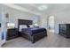 Spacious main bedroom with ensuite bathroom access, offering comfort and convenience with modern flooring and decor at 7695 Windy Meadow Ave, Las Vegas, NV 89178