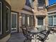 Charming outdoor patio area with seating and a stone turret feature, perfect for relaxing and entertaining at 7695 Windy Meadow Ave, Las Vegas, NV 89178
