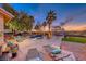 Backyard showcasing a custom pool, lounge area, and beautiful landscaping and pergola at 784 Tossa De Mar Ave, Henderson, NV 89002