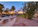 Backyard featuring a pool, lounge chairs, desert landscaping, and a cozy seating area at 784 Tossa De Mar Ave, Henderson, NV 89002