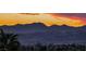 Breathtaking sunset view overlooking the city and majestic mountains in the distance, showcasing the community's scenic location at 784 Tossa De Mar Ave, Henderson, NV 89002