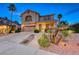 Inviting two-story home with desert landscaping and a two-car garage, located in a serene neighborhood at 784 Tossa De Mar Ave, Henderson, NV 89002