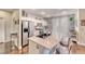 This kitchen features an island with seating, stainless steel appliances, and ample cabinet space at 784 Tossa De Mar Ave, Henderson, NV 89002