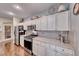 This kitchen has stainless steel appliances, granite countertops and lots of storage space at 784 Tossa De Mar Ave, Henderson, NV 89002