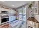 This well-equipped kitchen boasts stainless steel appliances, granite countertops, and access to the backyard pool at 784 Tossa De Mar Ave, Henderson, NV 89002